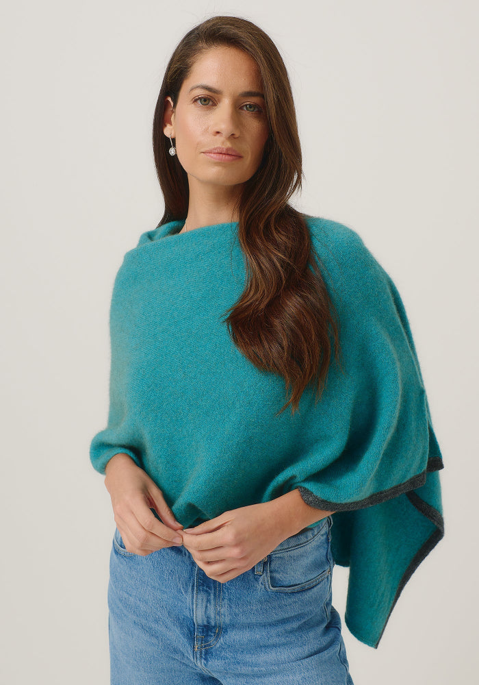 Possum and Merino

1623 Two Tone Poncho - A fan favourite, the Two Tone Poncho is a winner. With a relaxed fit and contrast coloured tipping it's cut for comfort and style. With a rainbow of colour options on offer, this is one you'll want in each colour! Classic fit.&nbsp;

Made in New Zealand from an exclusive Merinomink blend of 50% ZQ Merino, 40% Brushtail possum and 10% Mulberry silk.