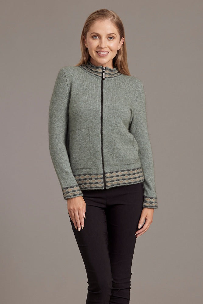 Possum and Merino.  5000 Wave Trim Zip Cardigan - is casual comfort at it's finest. The natural fibres of Possum Merino blended with Mulberry silk provide a luxurious comfort that will see this cardigan become your favourite go-to piece.  Hip-length zip up cardigan Detailed wave pattern trim Mid-weight warmth 35% Possum Fur, 55% Merino Wool, 10% Pure Mulberry Silk Proudly made in New Zealand