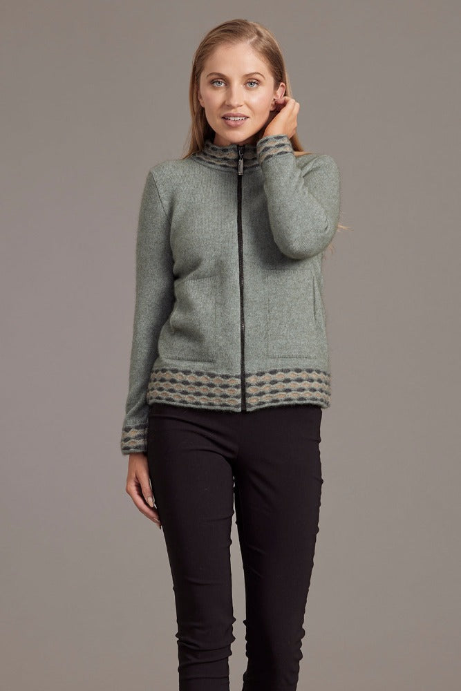 Possum and Merino.  5000 Wave Trim Zip Cardigan - is casual comfort at it's finest. The natural fibres of Possum Merino blended with Mulberry silk provide a luxurious comfort that will see this cardigan become your favourite go-to piece.  Hip-length zip up cardigan Detailed wave pattern trim Mid-weight warmth 35% Possum Fur, 55% Merino Wool, 10% Pure Mulberry Silk Proudly made in New Zealand