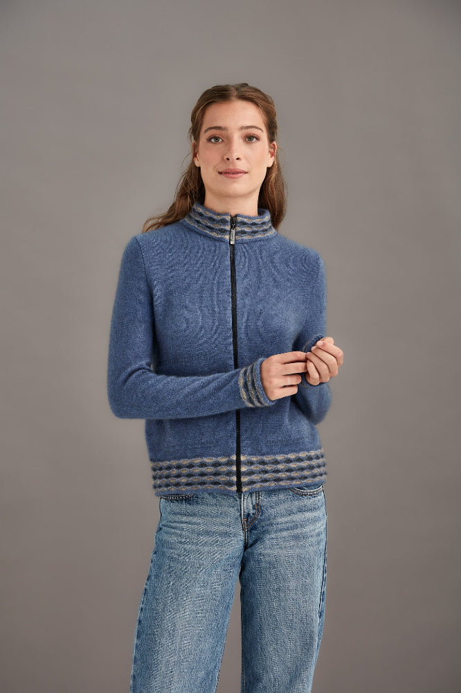 Possum and Merino.  5000 Wave Trim Zip Cardigan - is casual comfort at it's finest. The natural fibres of Possum Merino blended with Mulberry silk provide a luxurious comfort that will see this cardigan become your favourite go-to piece.  Hip-length zip up cardigan Detailed wave pattern trim Mid-weight warmth 35% Possum Fur, 55% Merino Wool, 10% Pure Mulberry Silk Proudly made in New Zealand