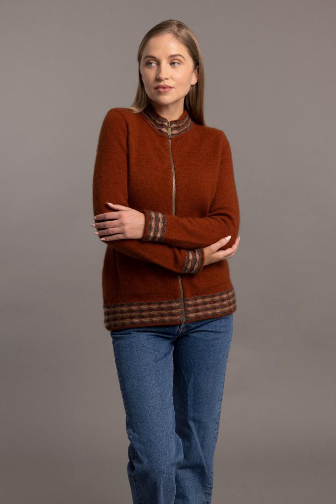 Possum and Merino.  5000 Wave Trim Zip Cardigan - is casual comfort at it's finest. The natural fibres of Possum Merino blended with Mulberry silk provide a luxurious comfort that will see this cardigan become your favourite go-to piece.  Hip-length zip up cardigan Detailed wave pattern trim Mid-weight warmth 35% Possum Fur, 55% Merino Wool, 10% Pure Mulberry Silk Proudly made in New Zealand