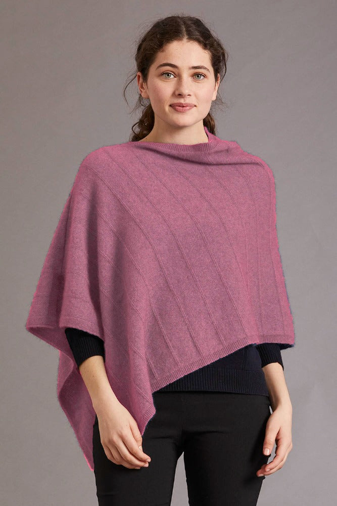 5007 Garter Detail Poncho - Elegance made easy with this garter detail.  Featuring diagonal garter detail and an asymmetric neck line, this piece is versatile and stylish.  35% Possum Fur, 55% Merino Wool, 10% Pure Mulberry Silk New Zealand designed and made Natural and sustainable One Size fits most