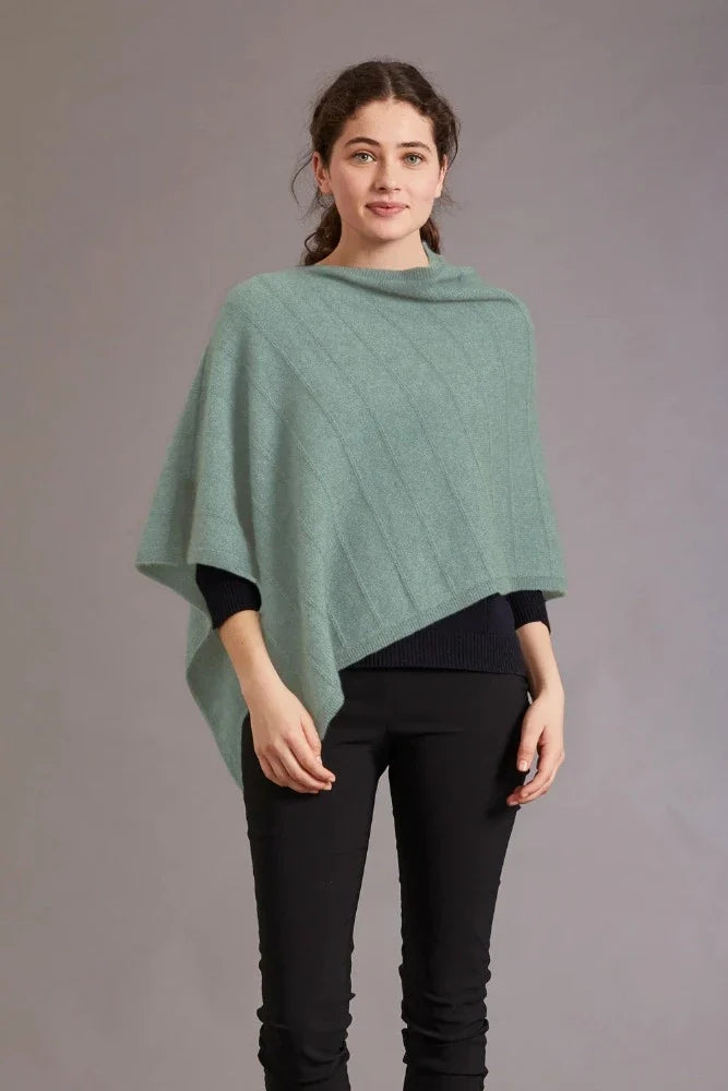 5007 Garter Detail Poncho - Elegance made easy with this garter detail.  Featuring diagonal garter detail and an asymmetric neck line, this piece is versatile and stylish.  35% Possum Fur, 55% Merino Wool, 10% Pure Mulberry Silk New Zealand designed and made Natural and sustainable One Size fits most