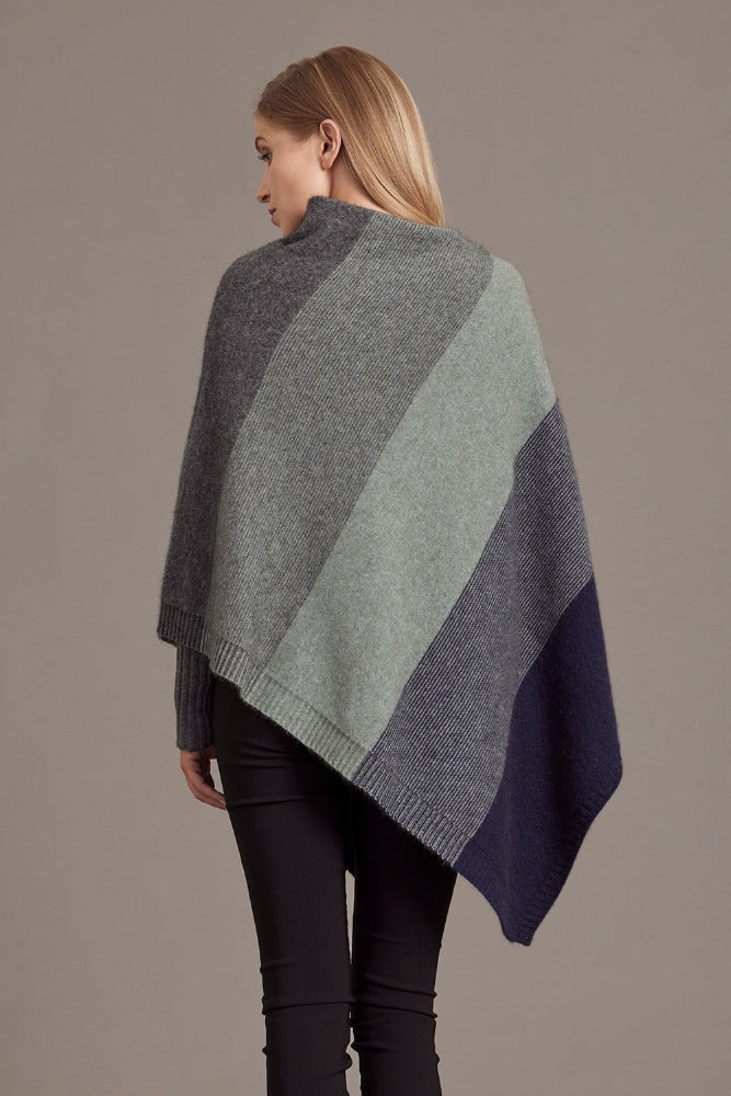 Possum and Merino

5010 Ombre Poncho - Our signature Ombre Poncho is available in five beautiful colour combinations. The incredible drape and classic style of this poncho will make it your go-to piece whenever there is a chill in the air.

Ombre Colour Pattern front and back
Mid-weight Warmth
35% Possum Fur, 55% Merino Wool, 10% Pure Mulberry Silk
New Zealand Designed and Manufactured

Natural and Sustainable
One Size Fits Most
Approximate size: Width 78 cm Length 66 cm.