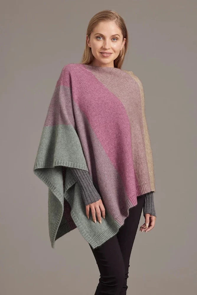 Possum and Merino

5010 Ombre Poncho - Our signature Ombre Poncho is available in five beautiful colour combinations. The incredible drape and classic style of this poncho will make it your go-to piece whenever there is a chill in the air.

Ombre Colour Pattern front and back
Mid-weight Warmth
35% Possum Fur, 55% Merino Wool, 10% Pure Mulberry Silk
New Zealand Designed and Manufactured

Natural and Sustainable
One Size Fits Most
Approximate size: Width 78 cm Length 66 cm.