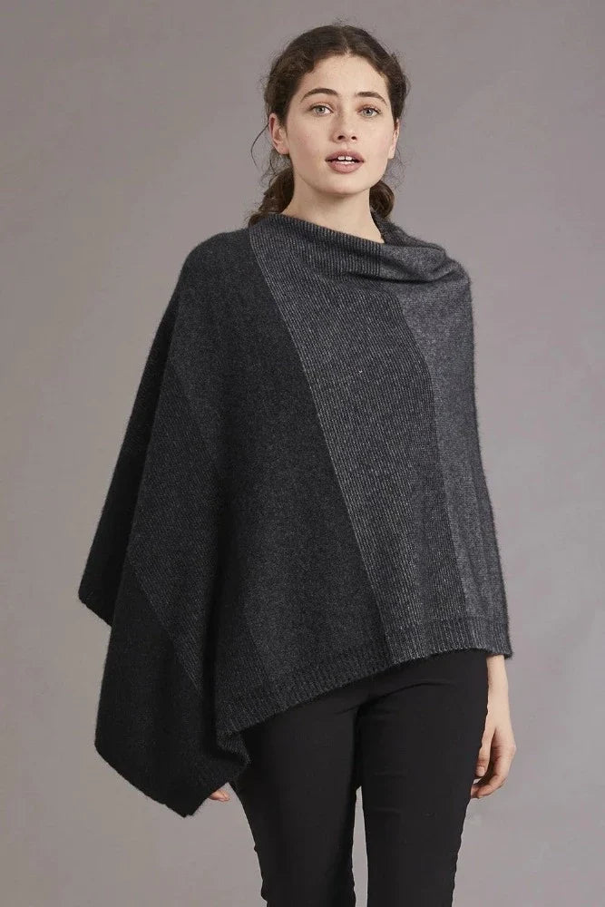 Possum and Merino

5010 Ombre Poncho - Our signature Ombre Poncho is available in five beautiful colour combinations. The incredible drape and classic style of this poncho will make it your go-to piece whenever there is a chill in the air.

Ombre Colour Pattern front and back
Mid-weight Warmth
35% Possum Fur, 55% Merino Wool, 10% Pure Mulberry Silk
New Zealand Designed and Manufactured

Natural and Sustainable
One Size Fits Most
Approximate size: Width 78 cm Length 66 cm.
