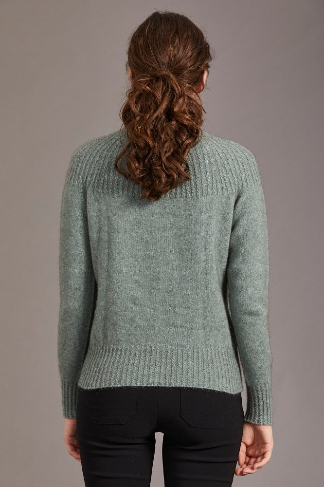Possum and Merino.  5017 Yoke Neck Cable Jersey - The Yolk Neck feature with mini cable detail on this new addition to our jersey range is lovely, feminine and very flattering. From weekend jeans to high waist skirts and trousers, we keep finding new and exciting ways to enjoy its easy elegance.      Mid weight knit for warmth and comfort Mini Cable Detail 35% Possum Fur, 55% Merino Wool, 10% Pure Mulberry Silk New Zealand Designed and Manufactured Natural and Sustainable