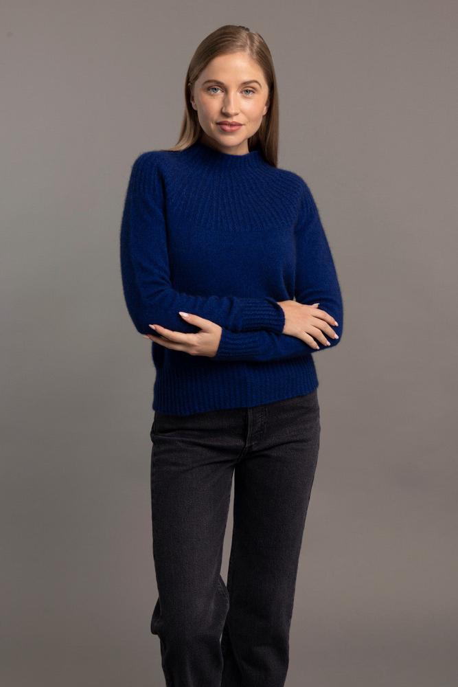 Possum and Merino.  5017 Yoke Neck Cable Jersey - The Yolk Neck feature with mini cable detail on this new addition to our jersey range is lovely, feminine and very flattering. From weekend jeans to high waist skirts and trousers, we keep finding new and exciting ways to enjoy its easy elegance.      Mid weight knit for warmth and comfort Mini Cable Detail 35% Possum Fur, 55% Merino Wool, 10% Pure Mulberry Silk New Zealand Designed and Manufactured Natural and Sustainable