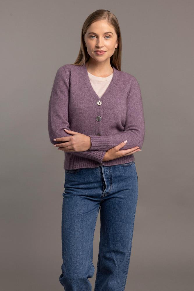 Possum and Merino  5034 Rib Cardi is knitted using our carefully sourced Natural Fibre blend of Possum Fur, Merino Wool and Mulberry Silk and finished with feature Shell Buttons, our Possum Merino Rib Cardi is a gorgeous take on a classic cardigan.  Rib detailing on the sleeve and hem partnered with a Deep V Neckline help to create a timeless, tailored look.