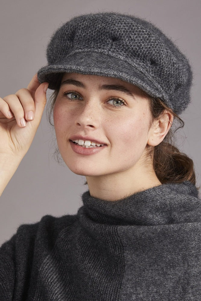 6030 Soft Peak Hat - Here at McDonald New Zealand, we have mastered the technique of blending together our iconic flora and fauna with contemporary fashion. This Soft Peak Hat truly demonstrates this as you step out in style while living the experience of the true warmth and luxury of the Possum Merino and Mulberry Silk mix.