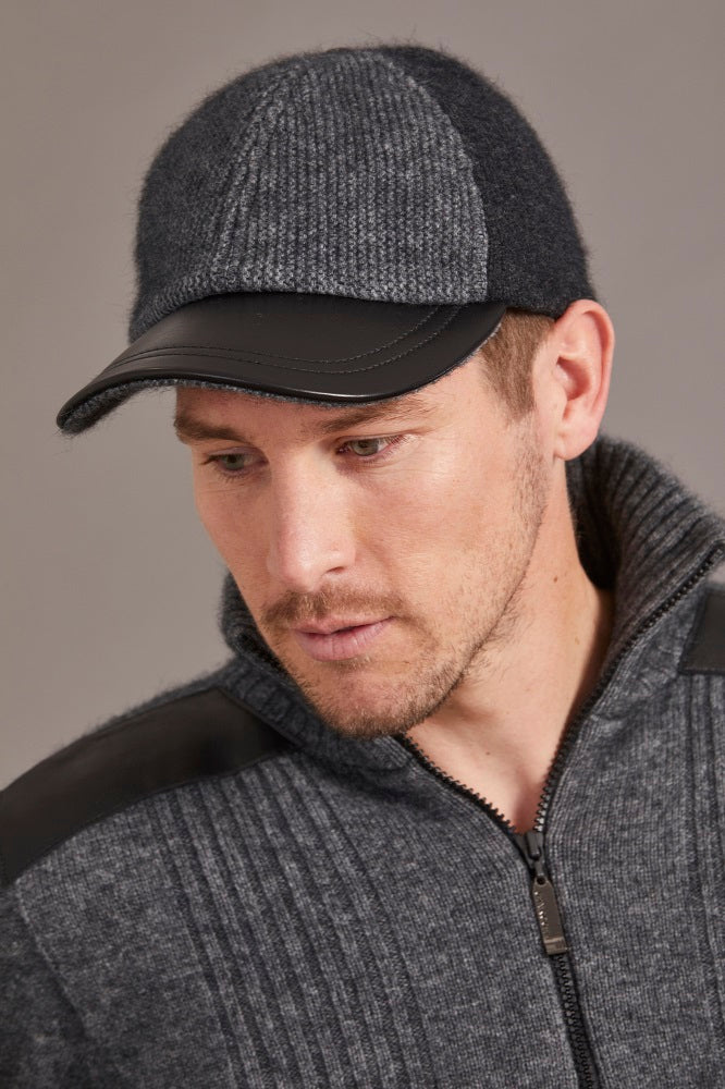 6071 Contrast Leather Peak Cap - Perfect piece for all ages, this Possum Merino cap is a timeless piece created with an artistic accent - keep the cold and the winter sun out. Step outdoors and make a statement. Intrinsically created from quality Possum Merino blended with luxurious Mulberry Silk and finished with a fine, genuine Lambskin Peak, you are sure to receive a quality warmth.