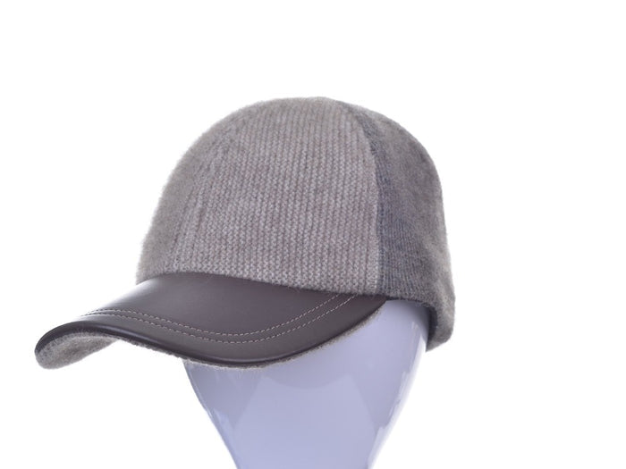 6071 Contrast Leather Peak Cap - Perfect piece for all ages, this Possum Merino cap is a timeless piece created with an artistic accent - keep the cold and the winter sun out. Step outdoors and make a statement. Intrinsically created from quality Possum Merino blended with luxurious Mulberry Silk and finished with a fine, genuine Lambskin Peak, you are sure to receive a quality warmth.