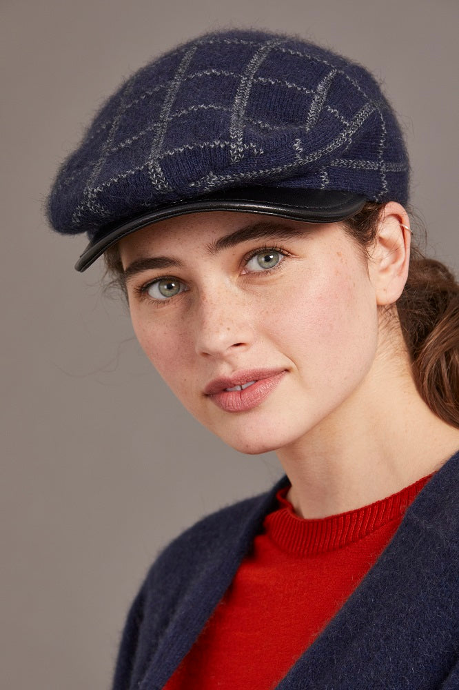 6081 Check Pattern Cheesecutter (with Lambskin Peak) - This is the classic Possum Merino men's cheesecutter to keep one's head warm while delivering timeless sophistication. The genuine lambskin leather peak compliments the design which has been specially crafted for you. Make it a great gift or keep one for yourself.
