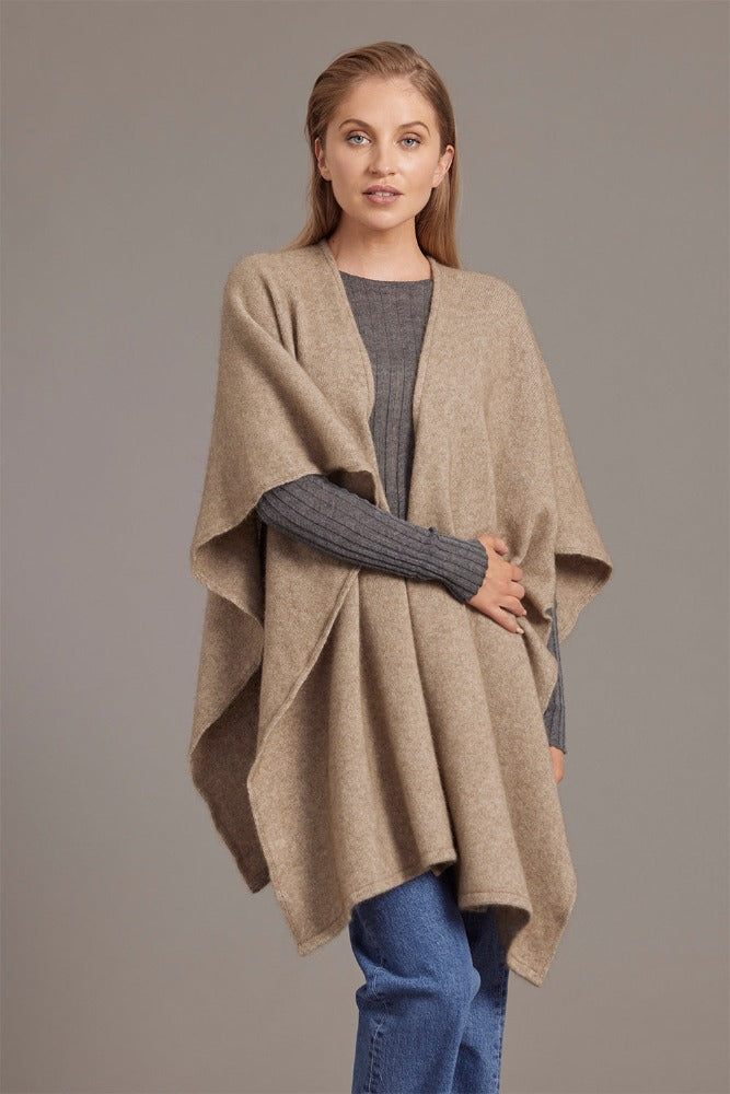616 Split Front Cape - This cape blurs the line between art-piece and clothing.  It impresses with its form and function, artfully draping on the body while keeping you exceptionally warm.  The merino and possum fibres combine with delicate mulberry silk to create something superb - warmth, sophistication and beauty.  Size: approximately 80 cm x 102 cm.