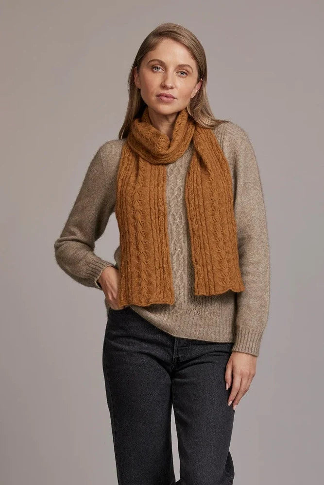 669 Cable Scarf - Feel the luxurious warmth as you wrap this beautifully soft scarf on your neck. Style by adding a touch of colour to your neutral outfit or toning down a bright outfit with your selection from our beautiful range of colours. McDonald NZ’s Possum Merino and Mulberry Silk Cable Scarf features the intricate detail of the cable knit structure. An essential accessory for every wardrobe.