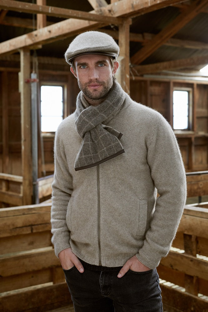 673 Check Scarf with Lambskin Trim - Checkered pattern never gets old and so is this Possum Merino check scarf with genuine lambskin leather trim. Accessorize yourself with this contemporary scarf and a matching 6081 Cheesecutter or choose it as the perfect luxury giveaway for someone special.
