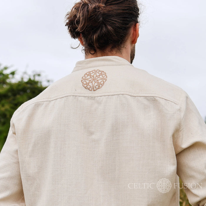 Back view of the Celtic Shield Collarless Shirt in beige, showing embroidered Celtic shield symbol on Irish Celtic Clothing designed by Celtic Fusion