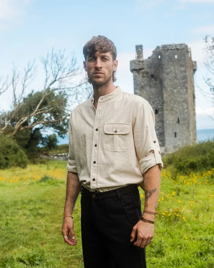 White Celtic Shield Collarless Shirt, front view with wooden buttons, stand collar and roll-up sleeve detail made by Irish designer at Celtic Fusion