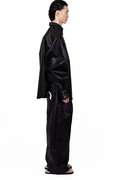 MANCANDY Coated Biker Baggy Jeans in black coated denim featuring articulated panel construction, knee pocket detail and embroidered back pockets.