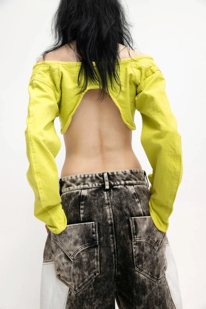 MANCANDY Corseted Crop Jacket in denim featuring a sculptural corseted construction, curved front panels, elongated sleeves and single-button closure.