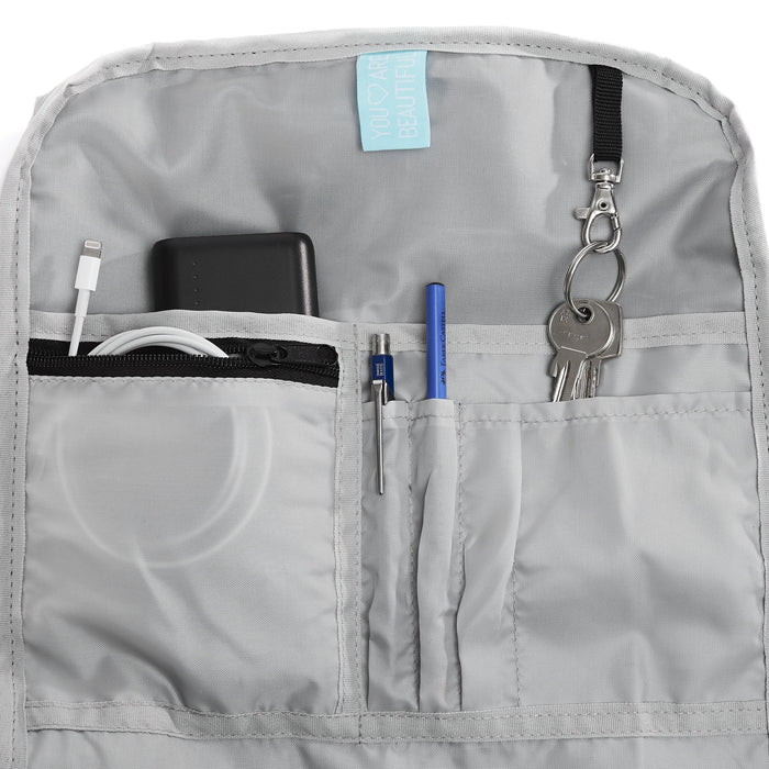Ela Mo™ Rolltop Rucksack | Salmon. Innenbereich des Rucksacks mit separatem Laptop- und Tablet-Fach.
