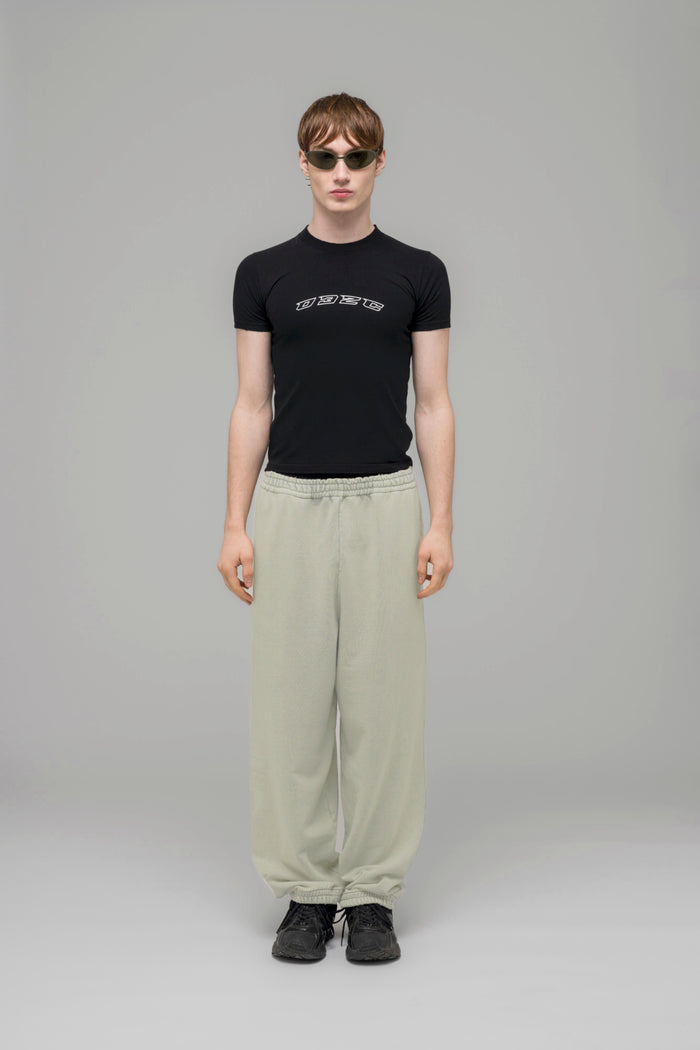 "HARDCORE WELLNESS" OVERSIZED SWEATPANTS - 032c