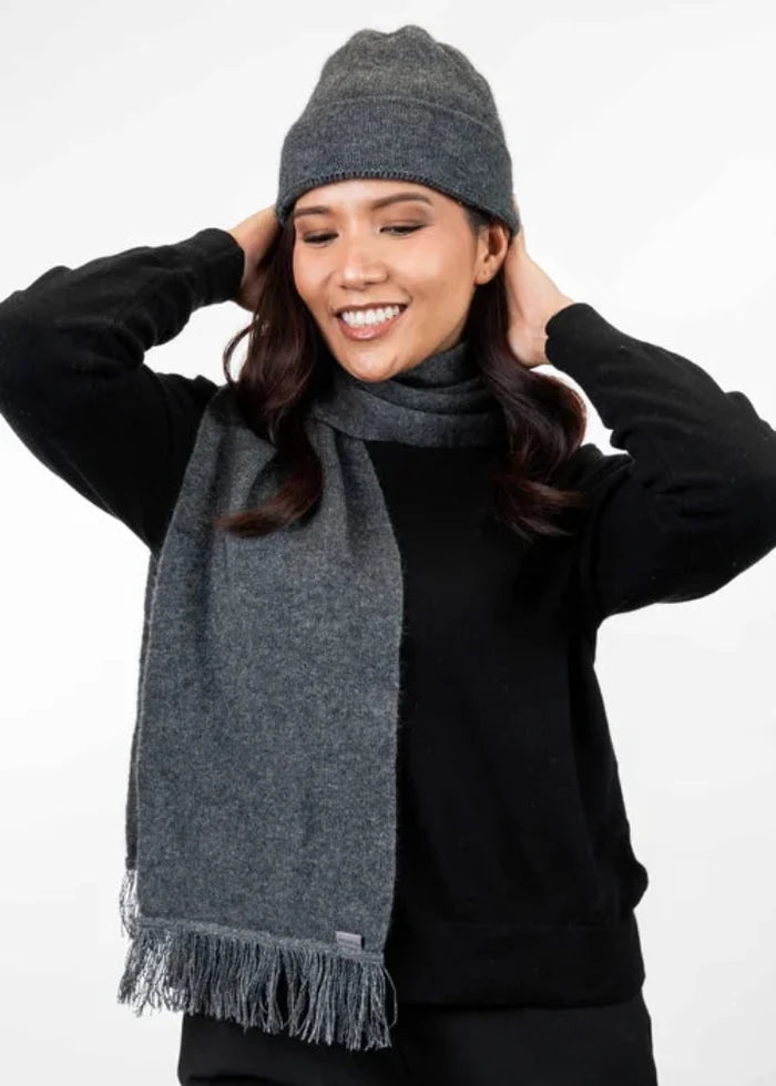 Possum and Merino  KO114 Scarf with Fringe -  A plain scarf with fringing which is generous in width and length.  Makes a set with KO159 Plain Beanie and KO48 Plain Gloves.  One Size - Approx. 22cm wide x 160cm long.  Made proudly in New Zealand from a premium blend of 40% possum fur, 50% merino lambswool & 10% mulberry silk.