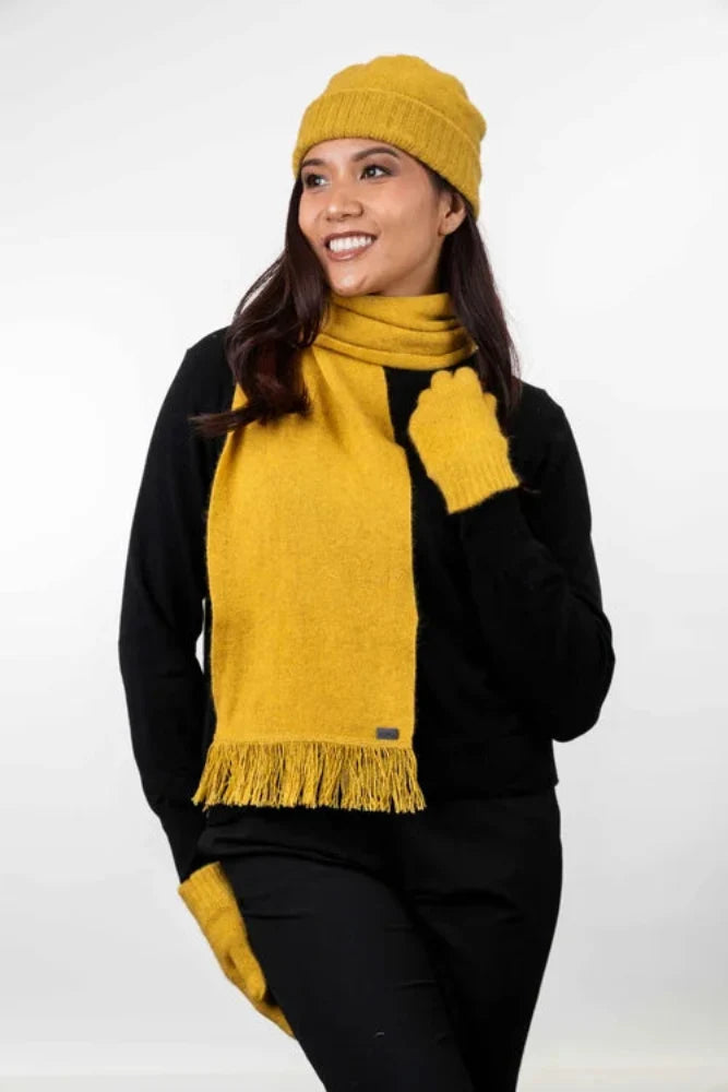 Possum and Merino  KO114 Scarf with Fringe -  A plain scarf with fringing which is generous in width and length.  Makes a set with KO159 Plain Beanie and KO48 Plain Gloves.  One Size - Approx. 22cm wide x 160cm long.  Made proudly in New Zealand from a premium blend of 40% possum fur, 50% merino lambswool & 10% mulberry silk.