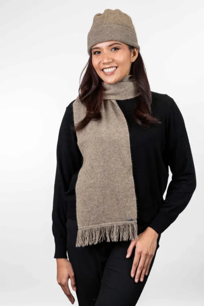 Possum and Merino  KO114 Scarf with Fringe -  A plain scarf with fringing which is generous in width and length.  Makes a set with KO159 Plain Beanie and KO48 Plain Gloves.  One Size - Approx. 22cm wide x 160cm long.  Made proudly in New Zealand from a premium blend of 40% possum fur, 50% merino lambswool & 10% mulberry silk.