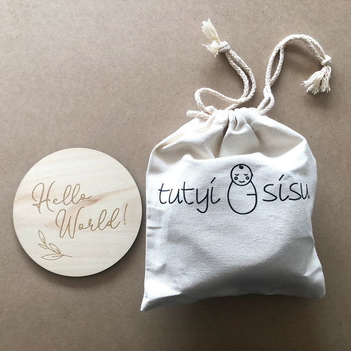 Wooden baby milestone cards packaged in keepsake pouch