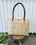 Tote bag with floral detail.