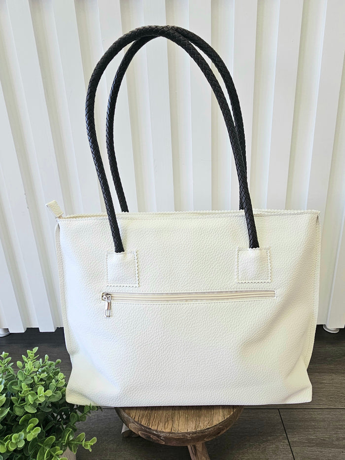 Back of tote bag with zipper pocket.