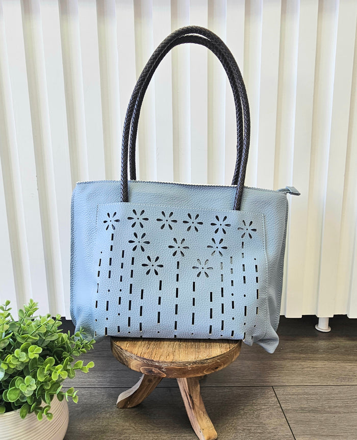 Tote bag with floral detail.