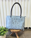 Tote bag with floral detail.