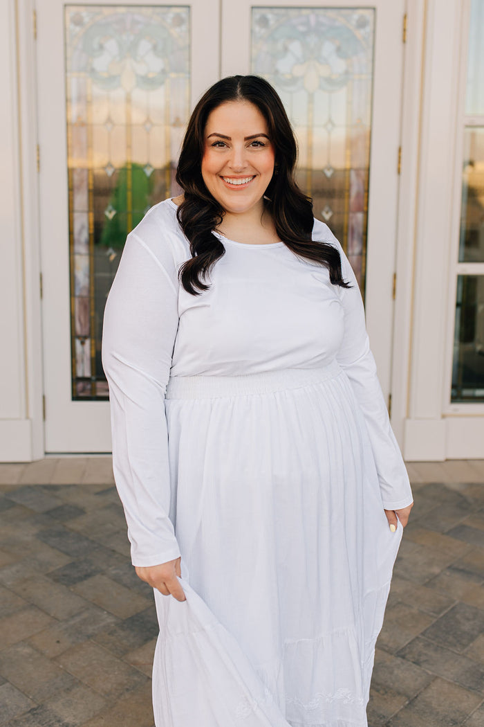 woman in long sleeved t-shirt and skirt