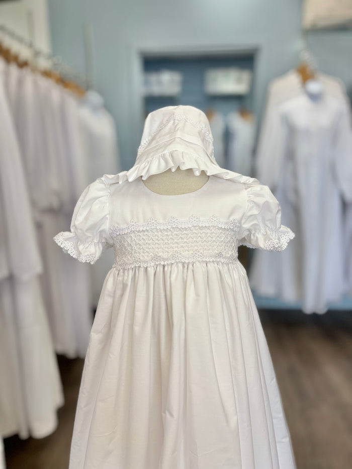 Long white cotton baby gown with smocking and bonnet.