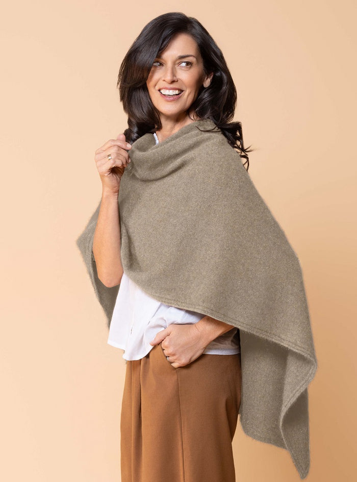 Possum and Merino.  NW3086 North Cape - Versatile cape designed to provide ultimate comfort and maximum freedom.  Single jersey construction, this garment can be worn numerous ways from a cape to knee rug and even a scarf.  Composition - 40% Possum Fur, 53% Merino, 7% Silk.  One Size.