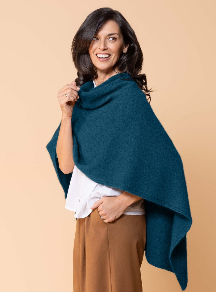 Possum and Merino.  NW3086 North Cape - Versatile cape designed to provide ultimate comfort and maximum freedom.  Single jersey construction, this garment can be worn numerous ways from a cape to knee rug and even a scarf.  Composition - 40% Possum Fur, 53% Merino, 7% Silk.  One Size.