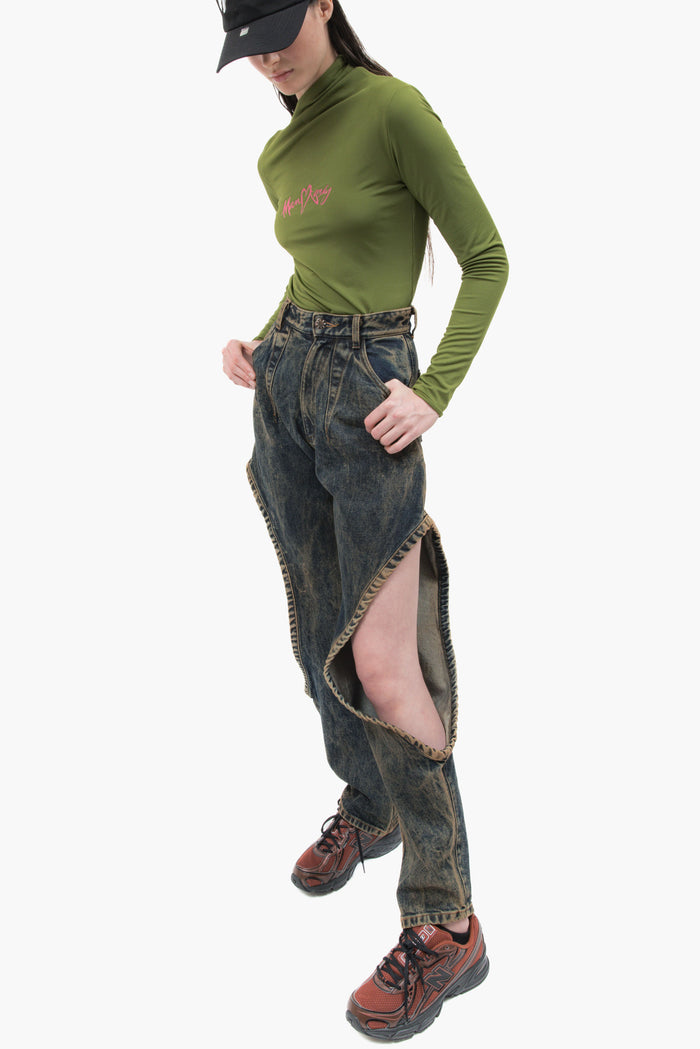 MANCANDY One Bite Jeans Dusty Blue in 100% cotton denim featuring a signature side cut-out, sculpted front pleat detail and embroidered back pocket logo.