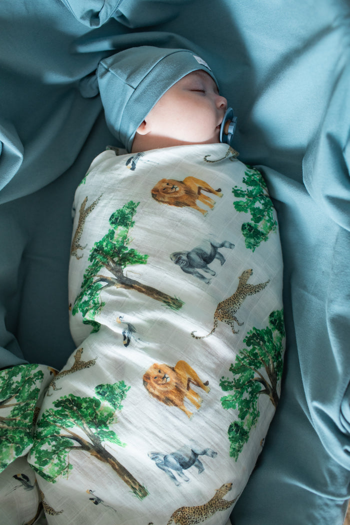 Lightweight organic cotton swaddle with African animal-inspired design