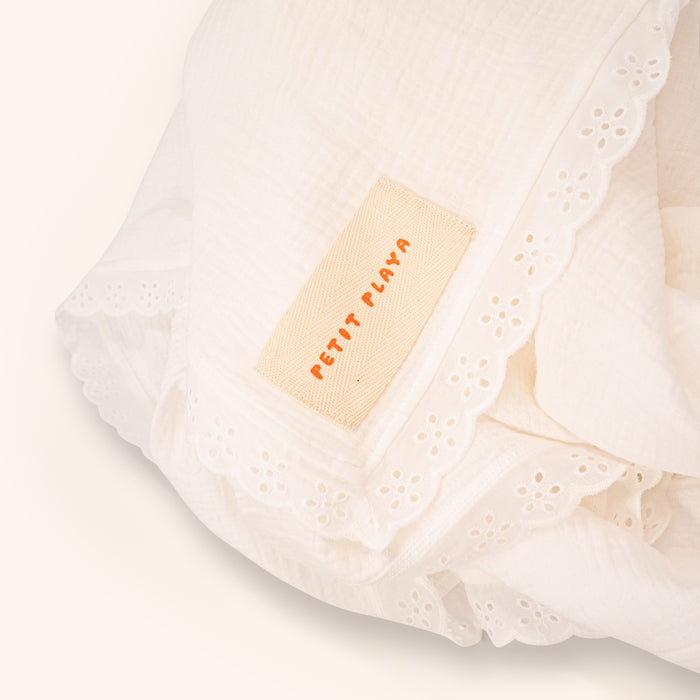 Petit Playa Organic Cotton Fleur Swaddle in Gardenia print, breathable organic cotton swaddle for babies and girls — image 8