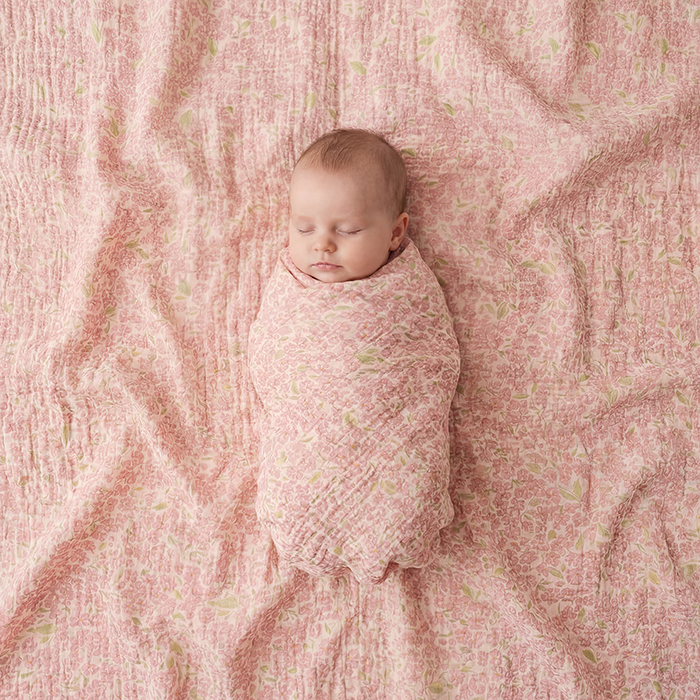 Petit Playa Organic Cotton Fleur Swaddle in Peony print, breathable organic cotton swaddle for babies and girls — image 2