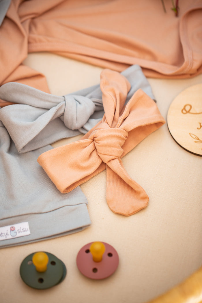 Neutral organic jersey swaddle set with headbands