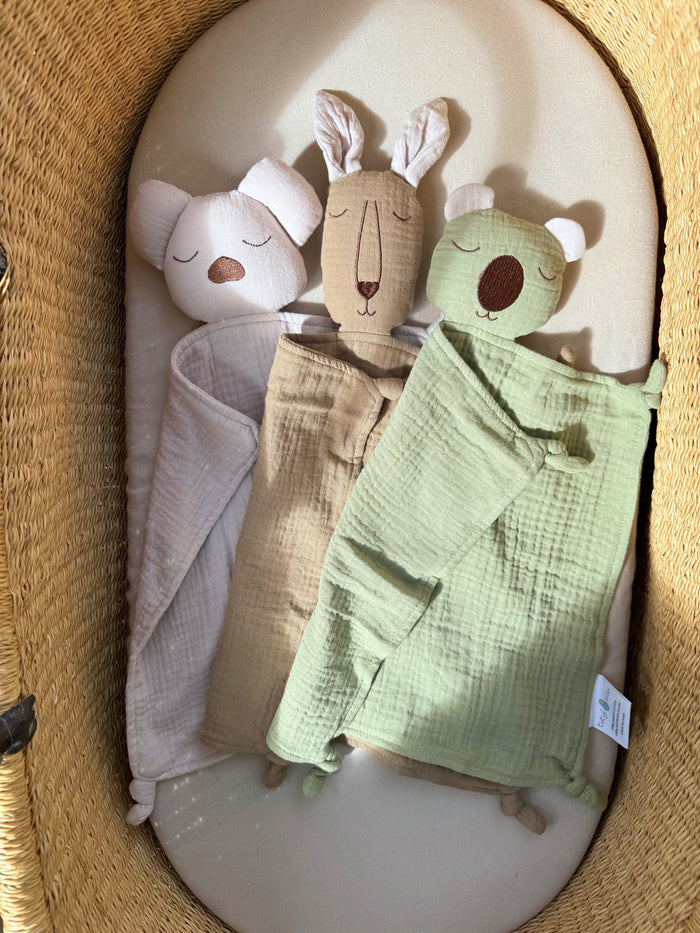 Three baby & toddler comforters inside a wicker basket. Koala, joey & wombat. Australiana. Designed for soothing and reassurance