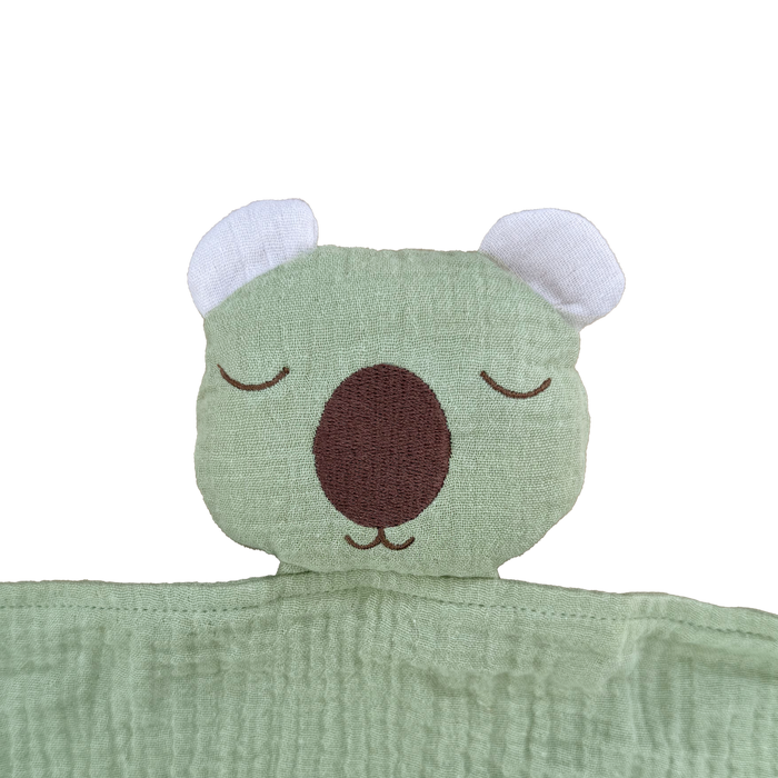 Soft organic muslin sleeping wombat comforter with cosy filled centre
