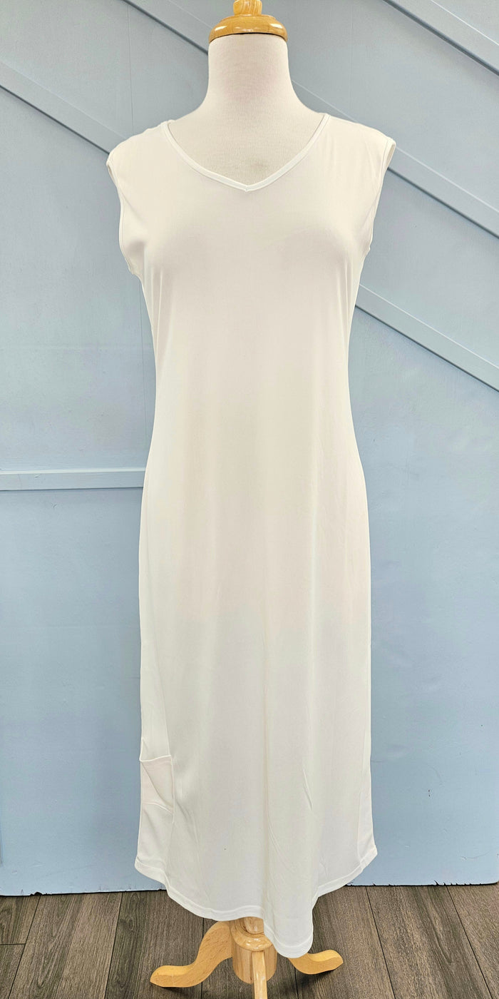 Raglan sleeve full length slip with pocket at hem.