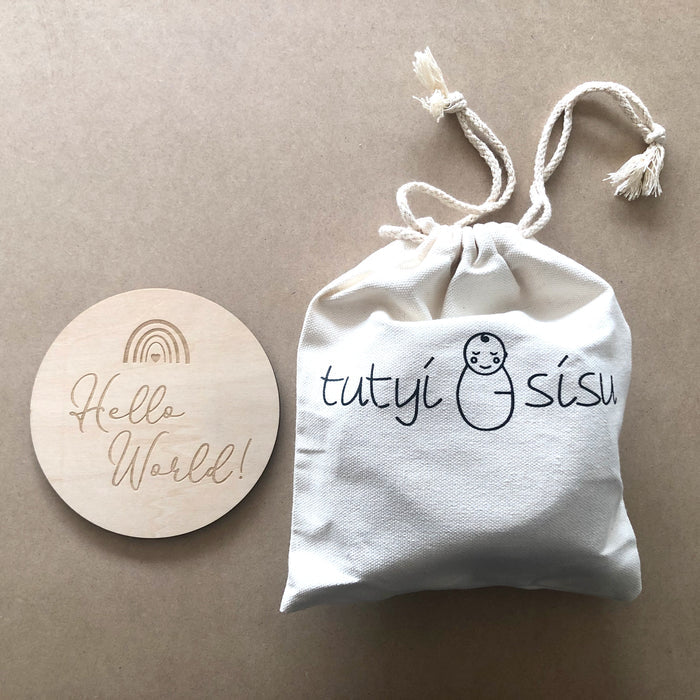 Wooden baby milestone cards packaged in keepsake pouch
