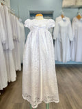 Long white lace and satin baby gown with bow.