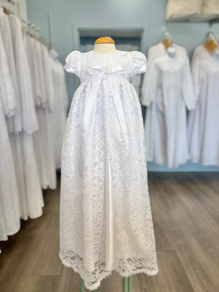 Long white lace and satin baby gown with bow.