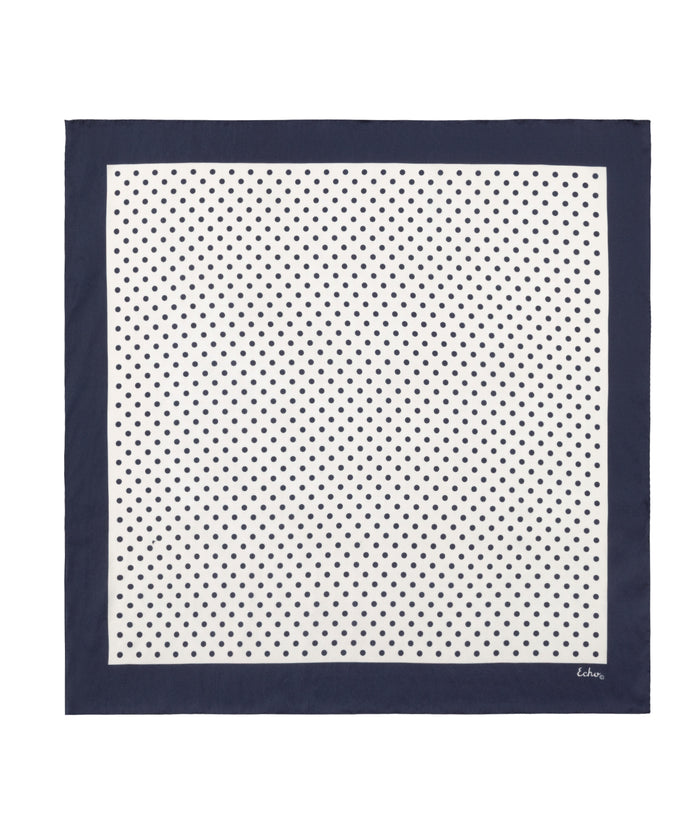 Navy blue square scarf with white polka dot pattern on a white background